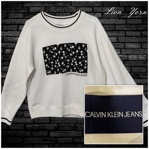 Calvin Klein Jeans Women’s White Sweatshirt with Black Floral Design